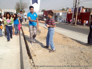Our son Japheth giving out tracks - We gave 20,000 tracks in two hours for the 5 de Mayo Parade